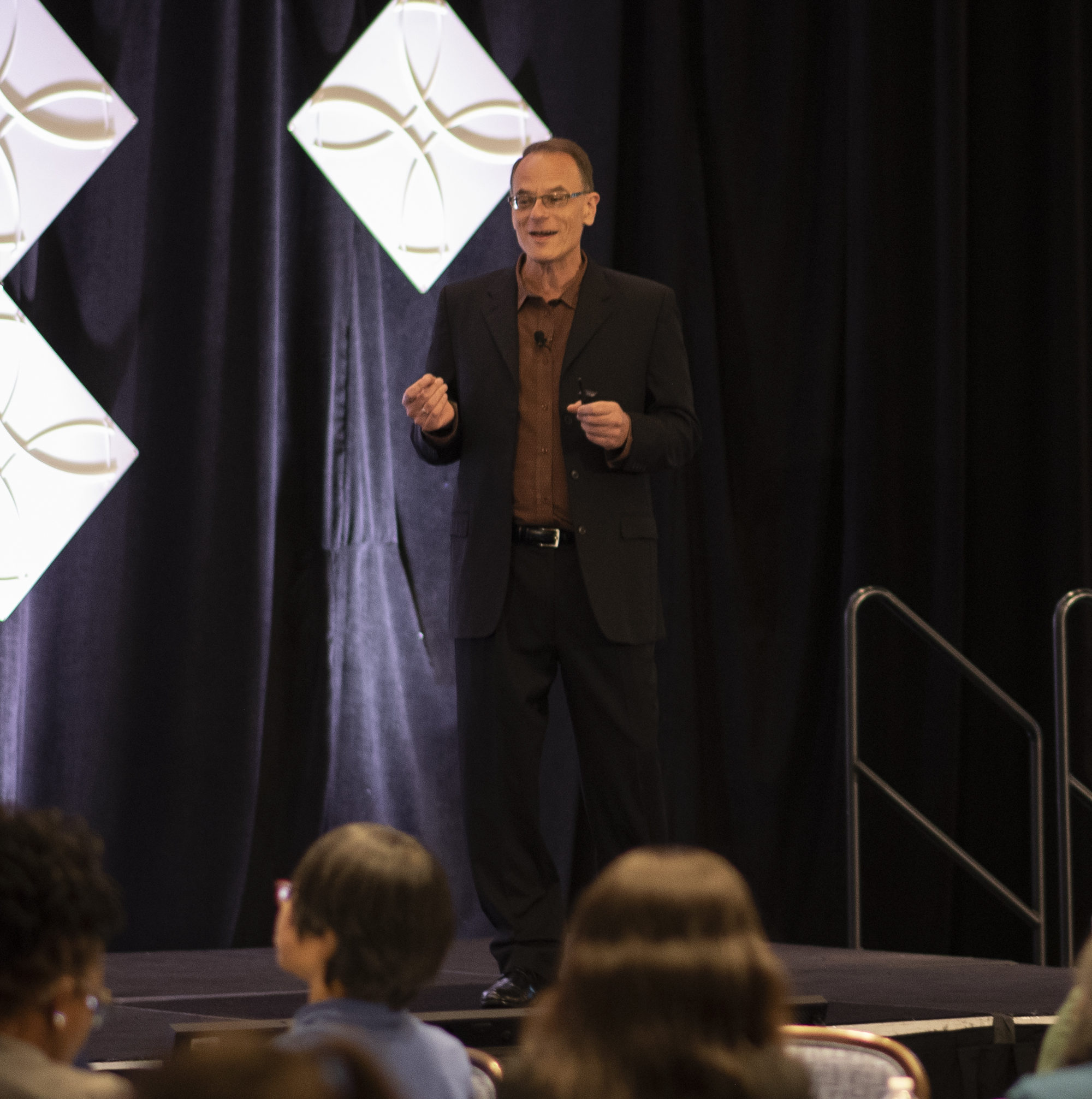 Bob Merberg speaks to conference attendees about job crafting and employee wellbeing